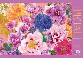 The 'Petal' jigsaw puzzle by Hardie Grant Books features a stunning array of intricately designed flowers in vibrant colors, set against a soft pink background. This 1000-piece puzzle showcases a variety of floral patterns and textures, offering a delightful challenge for puzzle enthusiasts and nature lovers alike.