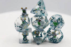 A colorful set of Koala RPG dice featuring six different polyhedral shapes. Each die is clear with vibrant blue, green, and yellow accents, and includes a tiny koala figure on one die. The numbers are clearly visible in bold print, making it easy to read and use during gameplay.