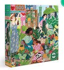 Rooftop Garden jigsaw puzzle by Eeboo featuring an illustrated scene with three women tending to a vibrant rooftop garden filled with flowers, plants, and greenery. The puzzle box showcases a colorful design, highlighting the 500 pieces and eco-friendly materials used in its creation.
