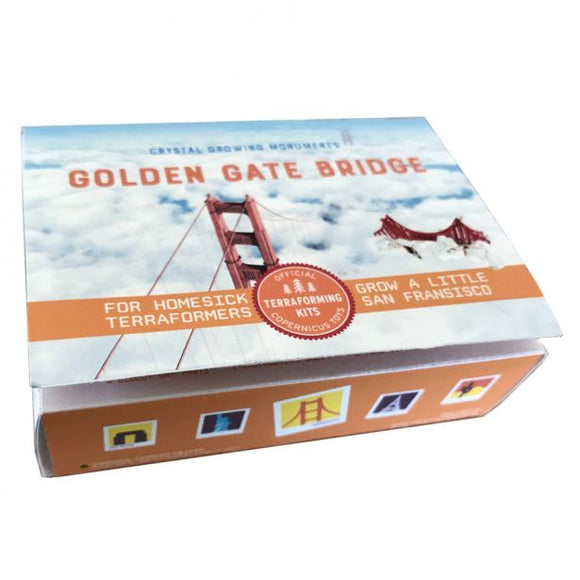 Crystal Growing Golden Gate Bridge kit by Copernicus, perfect for creating a miniature version of the iconic San Francisco landmark. The box showcases vibrant imagery of the bridge against a cloudy sky, with engaging phrases like 'For Homesick Terraformers' and 'Grow a Little San Francisco.' Ideal for DIY enthusiasts and science lovers alike.