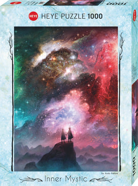 Cosmic Dust - Inner Mystic jigsaw puzzle by Heye featuring a vibrant cosmic scene with two figures standing on a rocky peak, gazing at a colorful nebula filled with stars and swirling clouds in shades of blue, pink, and purple. The puzzle has 1000 pieces and is designed by artist Andy Kehoe.