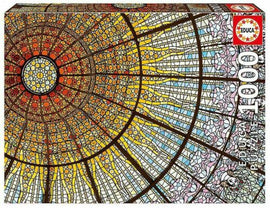 Educa jigsaw puzzle featuring a vibrant stained glass window design inspired by the Palace of Catalan Music. The puzzle contains 1000 pieces and showcases intricate patterns and rich colors, making it a captivating challenge for puzzle enthusiasts.