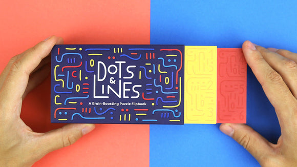 A person holding the FlipBoku: Dots & Lines flipbook from Boku Flipbooks. The flipbook has an eye-catching design with colorful dots and lines on a dark background, featuring the title 'Dots & Lines' prominently displayed. There are two colored tabs on the side, one red and one yellow, indicating different sections or puzzles within the book.