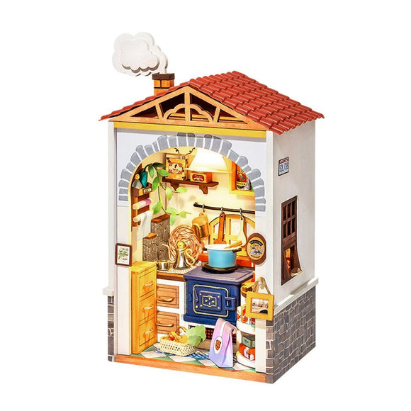 The Flavor Kitchen Model Kit by Robotime is a charming DIY model featuring a detailed kitchen scene. It includes miniature furniture and accessories like a stove, cupboard, and colorful decor, all housed in a small, house-like structure with a red roof and a chimney. Perfect for creative minds and craft enthusiasts.