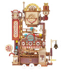 A detailed Chocolate Factory Marble Run Model Kit by Robotime, featuring intricate wooden components, colorful balls rolling through a mechanical system, candy-themed decorations, and a small bell. This DIY kit presents a whimsical and playful design, ideal for creativity and hands-on fun.