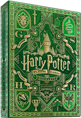 Harry Potter themed playing cards, featuring a green Slytherin design. The box showcases intricate gold designs, including Hogwarts castle and various house emblems.