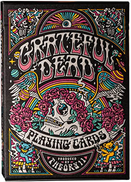 A beautifully illustrated deck of Grateful Dead Playing Cards by Theory 11, featuring vibrant colors, roses, a skull, and iconic band imagery, all in a decorative box.