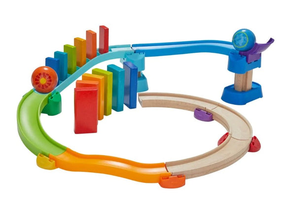 Kubu Ball Track Kringel Domino by HABA features a colorful track with wooden curves, vibrant dominoes, and a marble that activates a domino effect. Perfect for engaging creativity and fine motor skills in children.