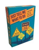 Just Tell Me What to Do game box by Flying Leap Games, featuring colorful graphics including caution signs and humorous text. The packaging highlights it as a party game that offers humorous advice and prompts for fun interactions.