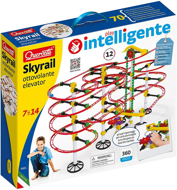 Quercetti Skyrail Ottovolante Elevator DIY kit with a colorful track system. The packaging showcases a boy playing with the elevator kit, which consists of 360 pieces, including tracks and gears. The design highlights the mechanical action of the elevator as it lifts marbles along the spiral tracks, offering educational benefits for ages 7 to 14.