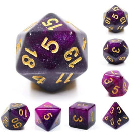 A striking Black & Purple Galaxy RPG Dice Set from Foam Brain Games. The set includes seven polyhedral dice featuring a captivating galaxy design with gold numbers for easy readability. Each die showcases a mix of deep black and vibrant purple hues, resembling a cosmic scene, perfect for tabletop role-playing games.