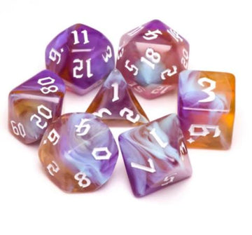 A vibrant Amethyst Sunset RPG Dice Set featuring seven polyhedral dice in various shapes. The dice are a beautiful blend of purple and orange hues with white numerals, perfect for tabletop gaming.