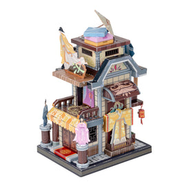 A beautifully crafted DIY architectural model kit featuring a traditional multi-storied building with intricate detailing, decorative elements, and miniature figures in historical attire. This 3D puzzle showcases vibrant colors and authentic designs, perfect for art and craft lovers.