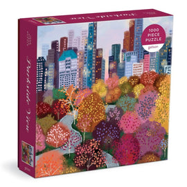 Parkside View jigsaw puzzle by Galison featuring a vibrant illustration of a city skyline surrounded by colorful autumn trees. The puzzle contains 1000 pieces and is packed in a beautifully designed box.