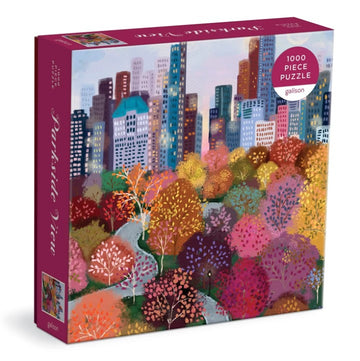 Parkside View jigsaw puzzle by Galison featuring a vibrant illustration of a city skyline surrounded by colorful autumn trees. The puzzle contains 1000 pieces and is packed in a beautifully designed box.