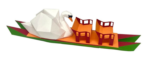 The Swan Boat Eureka Model Kit by Low Poly Craft featuring a geometric, low-poly swan design crafted from colorful paper. The swan is placed on a vibrant boat with two orange seats set against a green base, ideal for creative DIY projects.