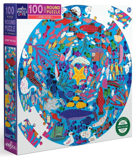Colorful Under the Sea Round Puzzle by Eeboo, featuring a vibrant underwater scene filled with various marine life such as fishes, starfish, and sea plants. This 100-piece jigsaw puzzle is designed for ages 5 and up and comes in a circular shape, enhancing puzzle-solving fun.