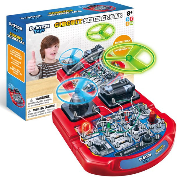 The 18+ Science Lab by Thin Air Brands is a DIY kit featuring a colorful circuit board with various components, including wires, switches, and spinning discs. It encourages hands-on learning with numerous experiments and promotes STEM education. A child with a thumbs-up gesture is shown in the background, illustrating excitement in scientific exploration.