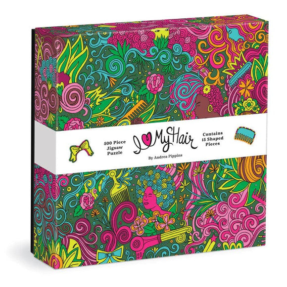 Colorful box of the I Love My Hair jigsaw puzzle designed by Andrea Pippins, featuring vibrant illustrations of hair, flowers, and shapes, with a label detailing it as a 500 piece puzzle with 15 shaped pieces.
