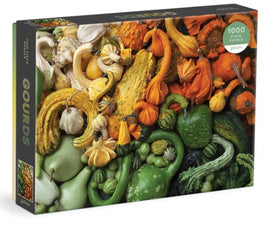 Colorful jigsaw puzzle featuring an assortment of gourds and squashes, including different shapes, sizes, and colors. The puzzle contains 1000 pieces and is designed by Galison, showcasing vibrant fall harvests.