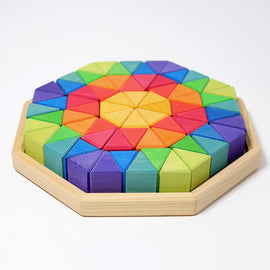A vibrant set of large octagon-shaped wooden blocks arranged in a colorful circular pattern. The blocks showcase a variety of bright colors including red, orange, yellow, green, blue, and purple, and are placed within a sturdy wooden base. Ideal for creative play and educational activities, these blocks encourage imaginative building and fine motor skills.