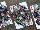 A vibrant set of playing cards featuring whimsical unicorn designs in a colorful, artistic style. The focus is on the Queen, King, and Joker cards, showcasing intricate details and a playful aesthetic with rainbow colors against a white background.