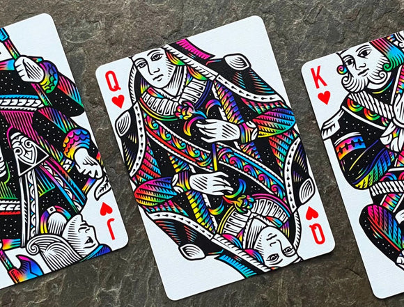 A vibrant set of playing cards featuring whimsical unicorn designs in a colorful, artistic style. The focus is on the Queen, King, and Joker cards, showcasing intricate details and a playful aesthetic with rainbow colors against a white background.