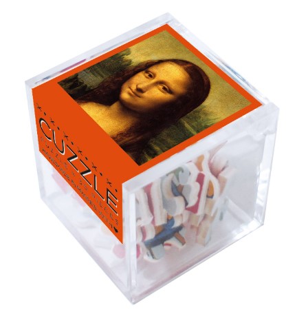 Cuzzle MONA LISA DA VINCI jigsaw puzzle by Wilson Jeux, featuring an image of the famous Mona Lisa painting on the packaging, with colorful puzzle pieces visible inside a transparent box.