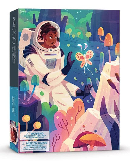 The Space Butterfly jigsaw puzzle features a vibrant and whimsical illustration of an astronaut interacting with a colorful butterfly in an alien landscape filled with unusual plants and mushrooms. The packaging shows the puzzle pieces count of 250 and emphasizes its creative and adventurous theme.