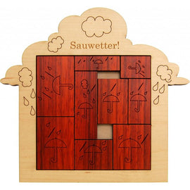 A wooden mechanical puzzle titled 'Stormy Weather (Sauwetter)' designed by Jean Claude. The puzzle features a playful design of umbrellas and raindrops, crafted from wood with engraved illustrations. The puzzle pieces are arranged within a cloud-shaped frame, showcasing a rich brown color.