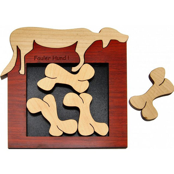 The Fauler Hund G-10 mechanical puzzle features a wooden frame with a silhouette of a dog on top. Inside the frame, there are four bone-shaped pieces crafted from smooth wood, designed to fit into the frame. The frame has a rich red finish with the words 'Fauler Hund!' engraved, adding a playful touch to this brain-teasing mechanical puzzle.