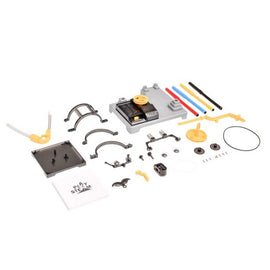 The Arts Robot Spiral Factory by PlaySTEM is a DIY kit featuring various colorful components, including gears, connectors, and a manual. The pieces are arranged on a white background, showcasing the creativity and engineering potential of this educational toy.