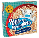 The 'Yeti In My Spaghetti' game box by PlayMonster features a playful white yeti character sitting in a bowl of spaghetti. The vibrant red and blue design showcases the title prominently, with additional text saying, 'Hey Get Out of My Bowl!' It highlights that the game is suitable for 2 or more players aged 4 and up. This family-friendly game promises fun and laughter as players try to free the yeti from the tangled noodles.