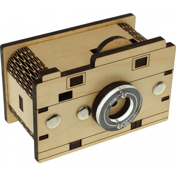 A mechanical puzzle designed to resemble a vintage camera, crafted from precision-cut wood. The puzzle features various interactive components, including knobs and a lens, inviting users to engage in problem-solving as they explore its intricate design.