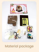 A Sweet Cake Station DIY kit by Guangzhou Hongda Craft Co., Ltd. The image shows a variety of materials included in the package, such as colorful cutouts, decorative elements, and a packaged instruction booklet, all laid out clearly for crafting a cake-themed station. The background is light with a warm aesthetic, emphasizing creativity and hands-on fun.