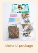 Flower Leisure Time DIY kit includes various materials packaged neatly. The set features a colorful instruction booklet, decorative pieces, and crafting supplies needed for a creative project. Ideal for crafting enthusiasts looking for a fun and engaging activity.