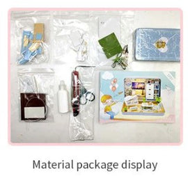 Summer Theater DIY kit displayed with various components including miniature furniture, decorations, and crafting supplies. Ideal for creative projects, this kit encourages imaginative play and hands-on building experience.