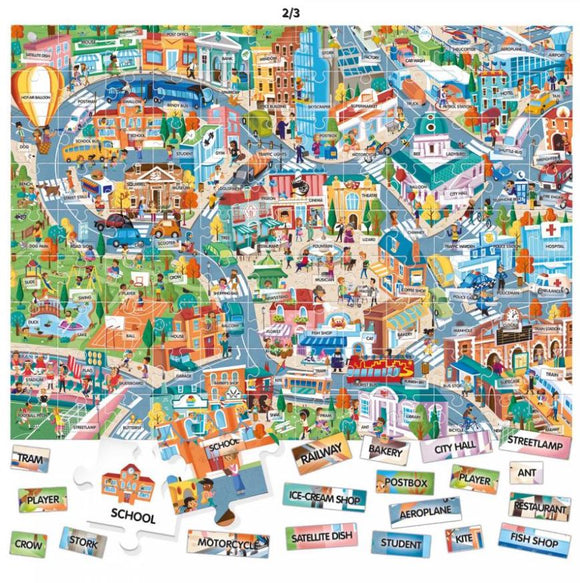 A colorful jigsaw puzzle depicting a vibrant city scene filled with various buildings, vehicles, and people engaging in different activities. The image showcases landmarks like a school, ice-cream shop, and city hall, along with playful illustrations of trams, dogs, and children. Puzzle pieces are shown at the bottom with labels of different city elements, enhancing the educational aspect of the jigsaw.