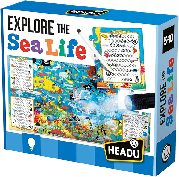 Explore the Sea Life Search and Find jigsaw puzzle by Headu. The box features colorful underwater illustrations, a magnifying glass, and two search lists. Perfect for children aged 5 to 10, this engaging puzzle encourages exploration and learning about marine life.