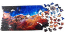 A vibrant jigsaw puzzle titled 'Cosmic Cliffs Infinite Galaxy' by Nervous System, featuring a stunning cosmic scene with swirling colors of deep blue, purple, and orange, showcasing stars and nebulae. Several puzzle pieces are scattered around the main image, highlighting the intricately designed celestial shapes.