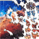 A colorful jigsaw puzzle featuring Cosmic Cliffs Infinite Galaxy design by Nervous System. The image shows vibrant space imagery with pieces in various shapes, including an astronaut and cosmic elements, waiting to be assembled.