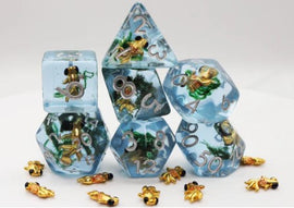 A vibrant Goldfish RPG Dice Set by Foam Brain, featuring six polyhedral dice in clear resin infused with miniature goldfish and aquatic plants. The set includes a d20, d12, d10, d8, d6, and d4, each uniquely designed, with golden numbers for easy readability. This playful gaming accessory is perfect for RPG enthusiasts looking to enhance their gaming experience.