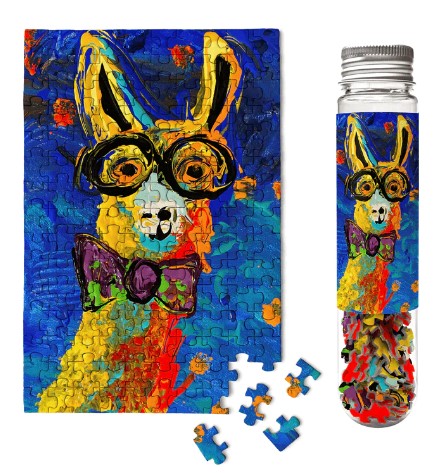 Lively Louis Llama Micropuzzle by Micro Puzzle, showcasing a vibrant jigsaw puzzle featuring a colorful, artistic depiction of a llama wearing glasses and a bowtie. The puzzle pieces are arranged beside it, and the completed puzzle is shown, reflecting a lively blue background with bold colors. A clear tube containing additional puzzle pieces is displayed alongside.