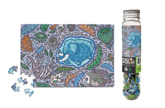 A colorful jigsaw puzzle titled 'Mammoth Fun' by Micro Puzzle, featuring a vibrant illustration of underwater creatures amidst a backdrop of marine flora. The image showcases both completed and scattered puzzle pieces, emphasizing the intricate design and engaging theme. The puzzle comes in a clear tube package, ideal for storage and display.