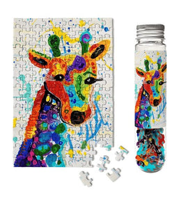 A colorful jigsaw puzzle featuring a vibrant rainbow giraffe illustration. The puzzle is partially completed, showcasing vivid colors and artistic details. It is packaged in a clear test tube along with loose puzzle pieces, presenting a unique and creative design suitable for puzzle enthusiasts and collectors.