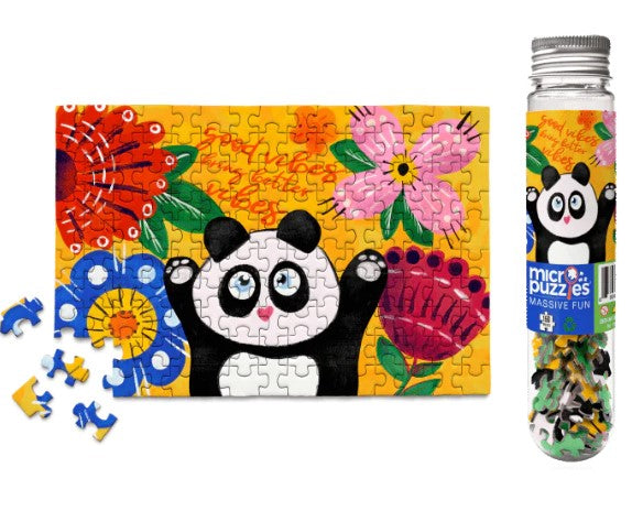 Good Vibes Micropuzzle featuring a cheerful panda surrounded by colorful flowers. The jigsaw puzzle is partially completed, showcasing vibrant artwork. Includes a sturdy container.