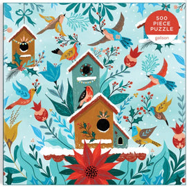 The Winter Perch jigsaw puzzle by Galison features a whimsical winter scene with colorful birds and birdhouses surrounded by vibrant foliage. This 500-piece puzzle showcases detailed illustrations of various birds in a snowy landscape, perfect for puzzle enthusiasts and nature lovers alike.