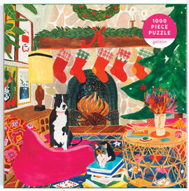 Vibrant 1000-piece jigsaw puzzle titled 'Fireside Friends' by Galison. Features a cozy winter scene with two pets, a dog and a cat, in a warm, colorful living room adorned with festive decorations, a fireplace, and a decorated Christmas tree.