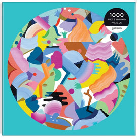 Luna de Flor Round Puzzle by Galison, featuring a vibrant design of abstract shapes and colors. This 1000-piece jigsaw puzzle presents a playful and artistic visual experience, ideal for puzzle enthusiasts and art lovers alike.