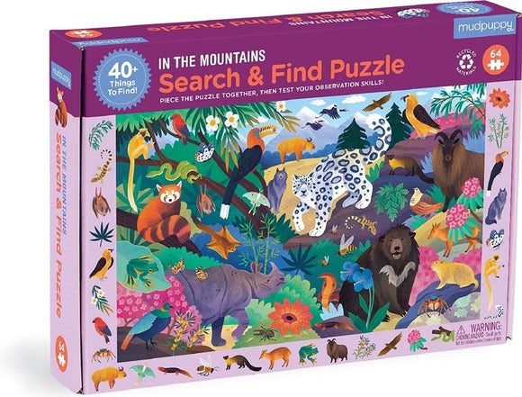 The In the Mountains Search & Find Puzzle by Mudpuppy features a vibrant illustration of various mountain animals and flora, inviting players to piece together the jigsaw and search for over 40 hidden items. The puzzle is colorful and engaging, suitable for both children and adults, promoting observation skills and problem-solving.